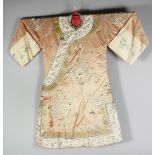 A 20TH CENTURY CHINESE EMBROIDERED SILK ROBE, finely embroidered with native flora, butterflies