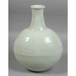 A CHINESE WHITE GLAZED PORCELAIN MOON FLASK, with incised floral decoration, with four-character