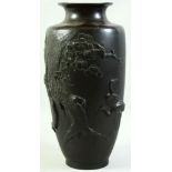 A SUPERB JAPANESE MEIJI PERIOD BRONZE RELIEF DECORATED VASE, the raised decoration depicting