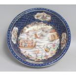 A CHINESE EXPORT BLUE AND WHITE / FAMILLE ROSE PORCELAIN BOWL, the interior centre painted with a