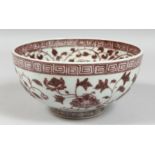 A CHINESE UNDERGLAZE RED PORCELAIN BOWL, foliate decoration, and Greek key rim. 19.5cm diameter