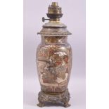 A JAPANESE SATSUMA PORCELAIN LAMP VASE with metal mounts, decorated with panels of figures,