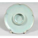 A CHINESE CELADON PORCELAIN CUP STAND in the Ru-ware style. 13cm diameter