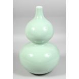 A GOOD LARGE CHINESE CELADON GLAZE DOUBLE GOURD VASE, the base with six-character mark. 33.5cm high