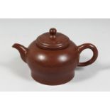 A LARGE CHINESE YIXING TEAPOT with fitted strainer, the inner lid and base with impressed marks.