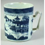 A CHINESE BLUE AND WHITE PORCELAIN TANKARD, decorated with a landscape scene, 11cm high.