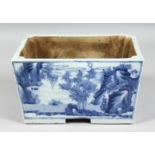 A CHINESE BLUE AND WHITE PORCELAIN RECTANGULAR PLANTER, each side depicting landscape scenes with