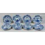 A SET OF EIGHT 18TH CENTURY CHINESE BLUE AND WHITE PORCELAIN DISHES, the centre depicting a