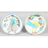 TWO TURKISH KUTAHYA GLAZED POTTERY DISHES, one painted with a figure, the other with a bird, each