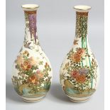 A SMALL PAIR OF JAPANESE SATSUMA PORCELAIN BOTTLE VASES, painted with birds and native flora with