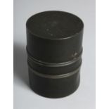 A CHINESE CYLINDRICAL METAL TEA CADDY, the base with impressed mark. 10cm high