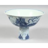 A CHINESE BLUE AND WHITE PORCELAIN STEM CUP, the exterior painted with dragons amongst stylised