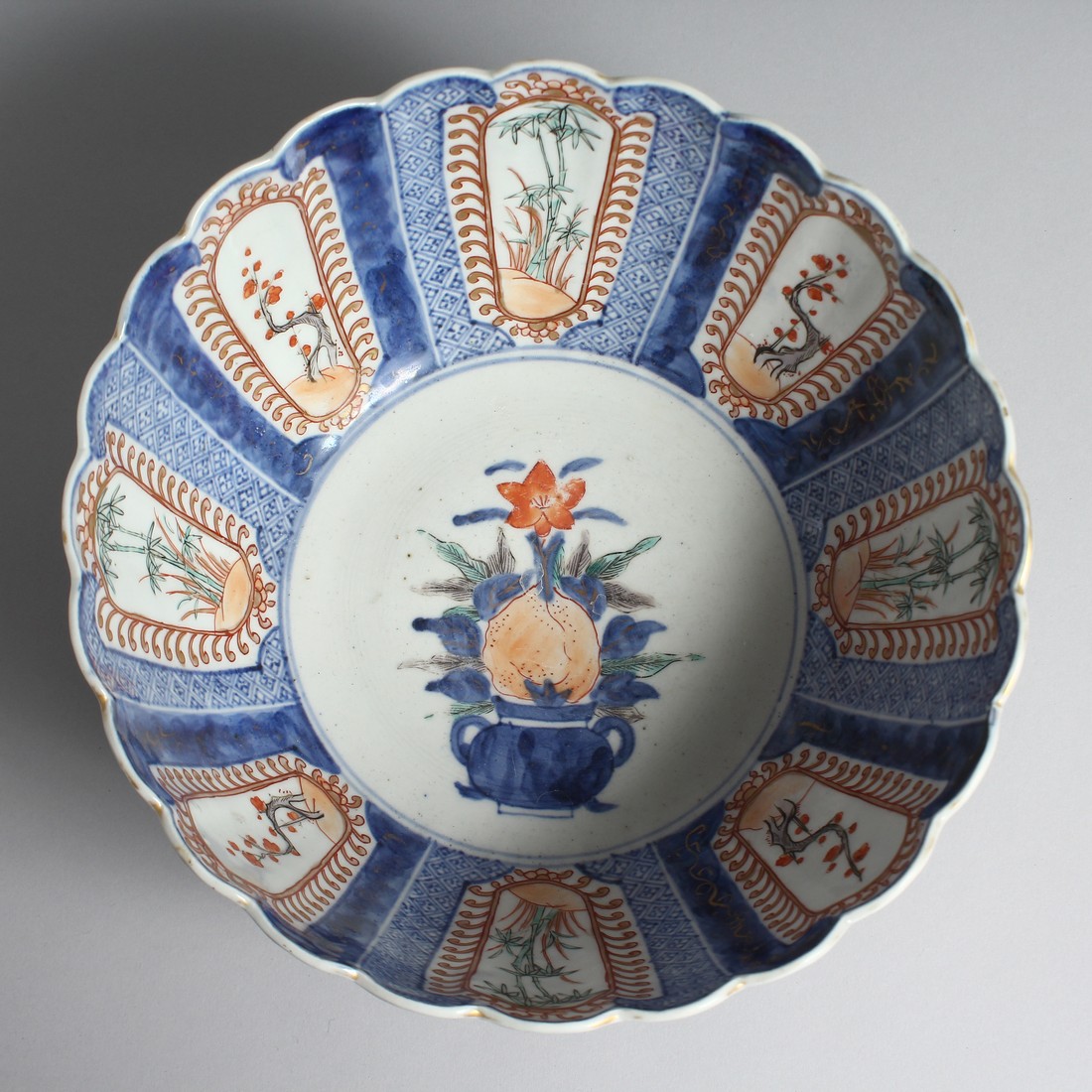 A JAPANESE IMARI PORCELAIN BLUE AND WHITE BOWL, with fluted-form, and decorated with panels of - Image 5 of 7