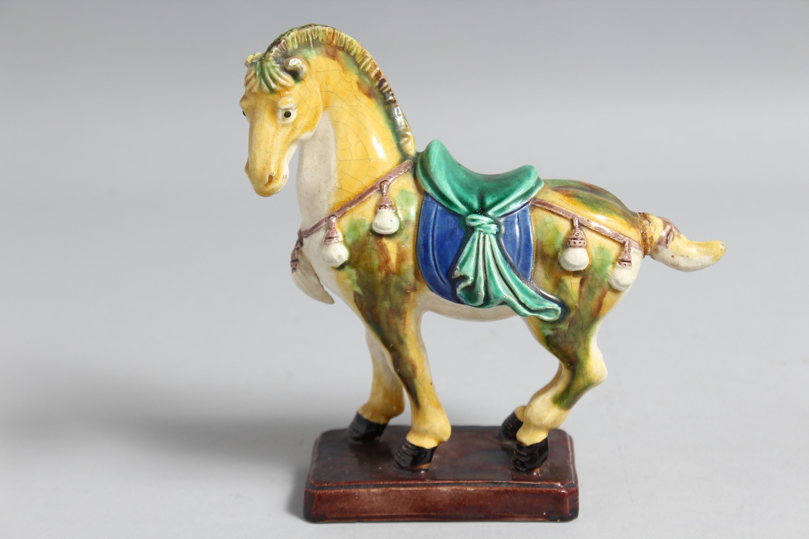 A COLLECTION OF FOUR CHINESE GLAZED POTTERY FIGURES OF ANIMALS, including a sancai horse, 14cm long; - Image 2 of 5