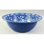 A LARGE CHINESE POWDER BLUE GROUND PORCELAIN BOWL, the interior decorated with various native