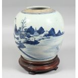 A CHINESE BLUE AND WHITE PORCELAIN JAR on a fitted hardwood stand, the body depicting a landscape