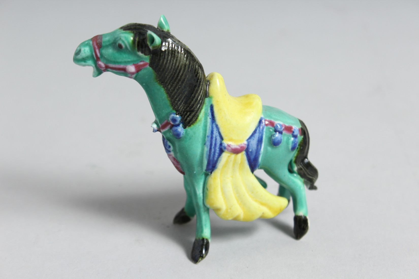 A COLLECTION OF FOUR CHINESE GLAZED POTTERY FIGURES OF ANIMALS, including a sancai horse, 14cm long; - Image 5 of 5