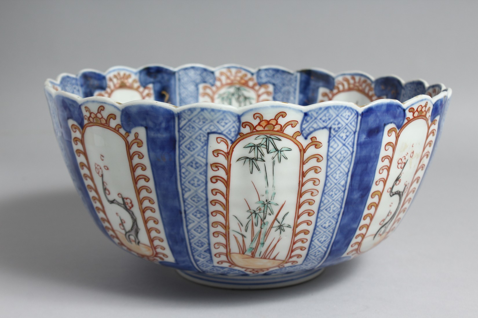 A JAPANESE IMARI PORCELAIN BLUE AND WHITE BOWL, with fluted-form, and decorated with panels of - Image 2 of 7