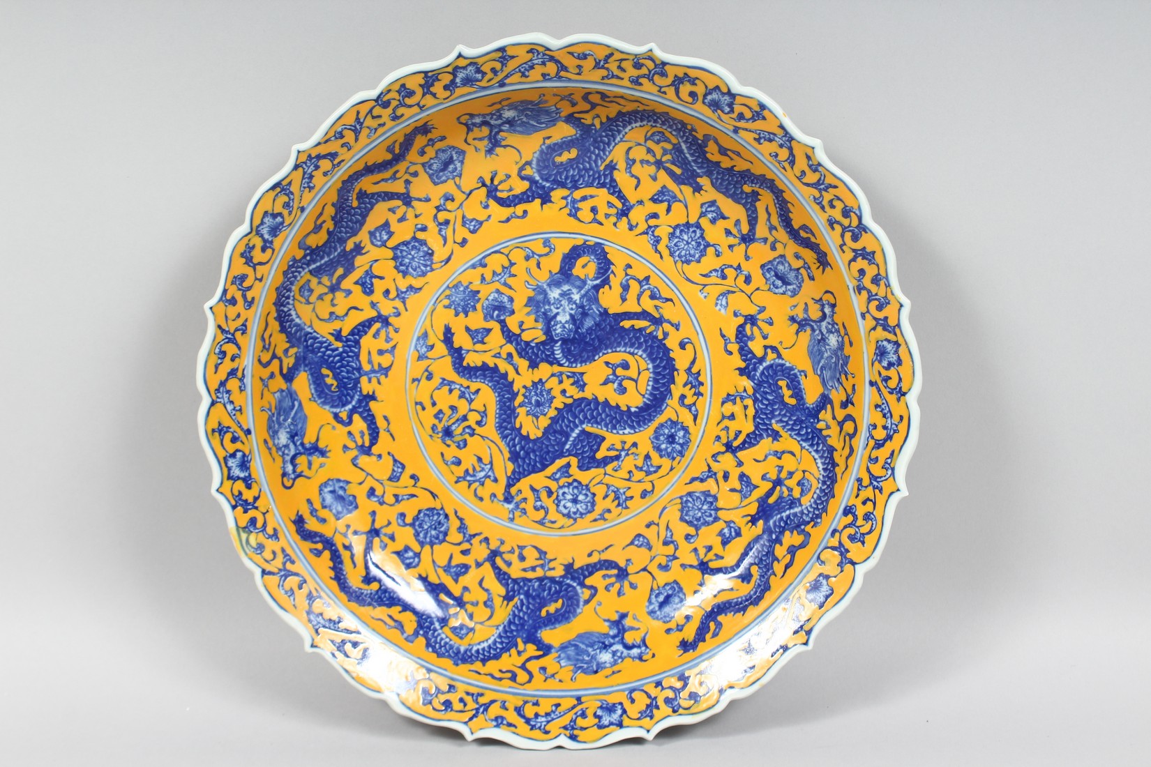 THREE LARGE CHINESE PORCELAIN DISHES, comprising two blue and white and one yellow ground dish; each - Image 3 of 8