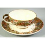 A SMALL JAPANESE SATSUMA CUP AND SAUCER, finely decorated with flowers and butterflies, each piece