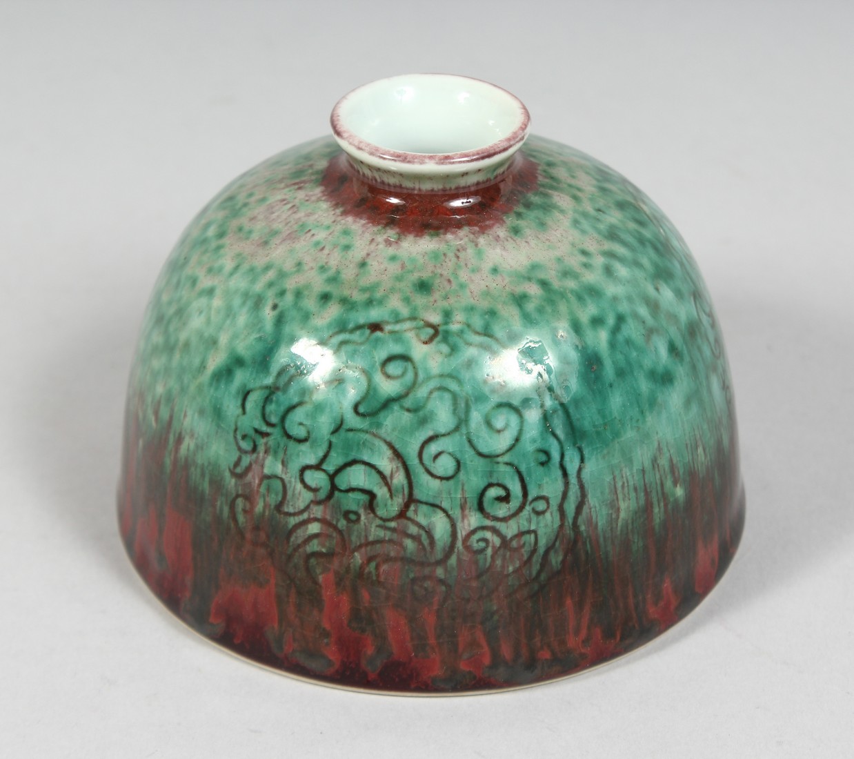 A CHINESE FLAMBE GLAZE PORCELAIN WATER POT, six character mark to base, 11cm diameter.