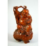 A GOOD CHINESE CARVED BOXWOOD FIGURE, of an immortal seated upon a beast, 14cm high.