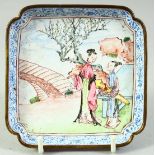 A CHINESE SQUARE FORM ENAMELLED DISH, painted with two female figures in a garden, 10cm sqaure.