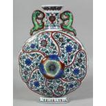 A LARGE CHINESE DOUCAI TWIN-HANDLED PORCELAIN MOON FLASK decorated all over with flowerhead and vine