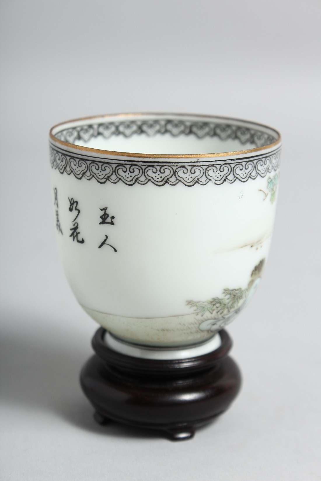 A CHINESE EGGSHELL PORCELAIN CUP AND HARDWOOD STAND, the cup painted with a female figure seated - Image 2 of 8