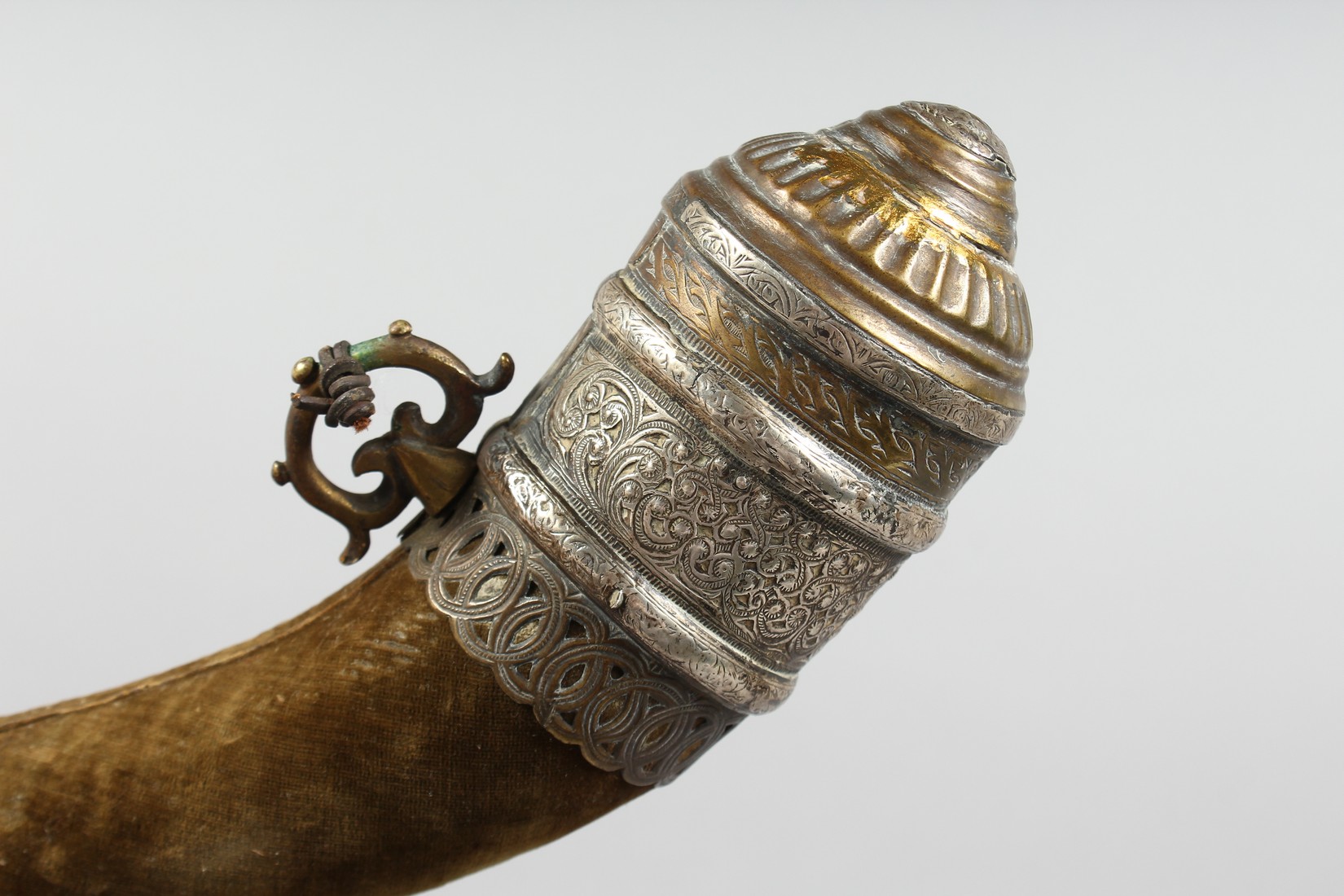 A 19TH CENTURY MOROCCAN SILVER AND BRASS MOUNTED POWDER HORN, the horn overlaid with velvet, 35cm - Image 2 of 4