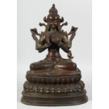 A GOOD LARGE BRONZE SEATED DEITY on a lotus base. 35cm high