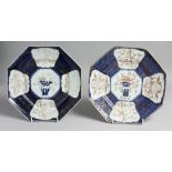 A PAIR OF CHINESE BLUE AND WHITE OCTAGONAL PORCELAIN DISHES, with gilt foliate decoration. 25cm at