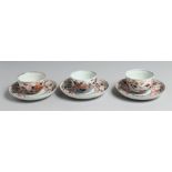 A SET OF THREE JAPANESE IMARI PORCELAIN CUPS AND SAUCERS, each with floral decoration. Plates 14.5cm