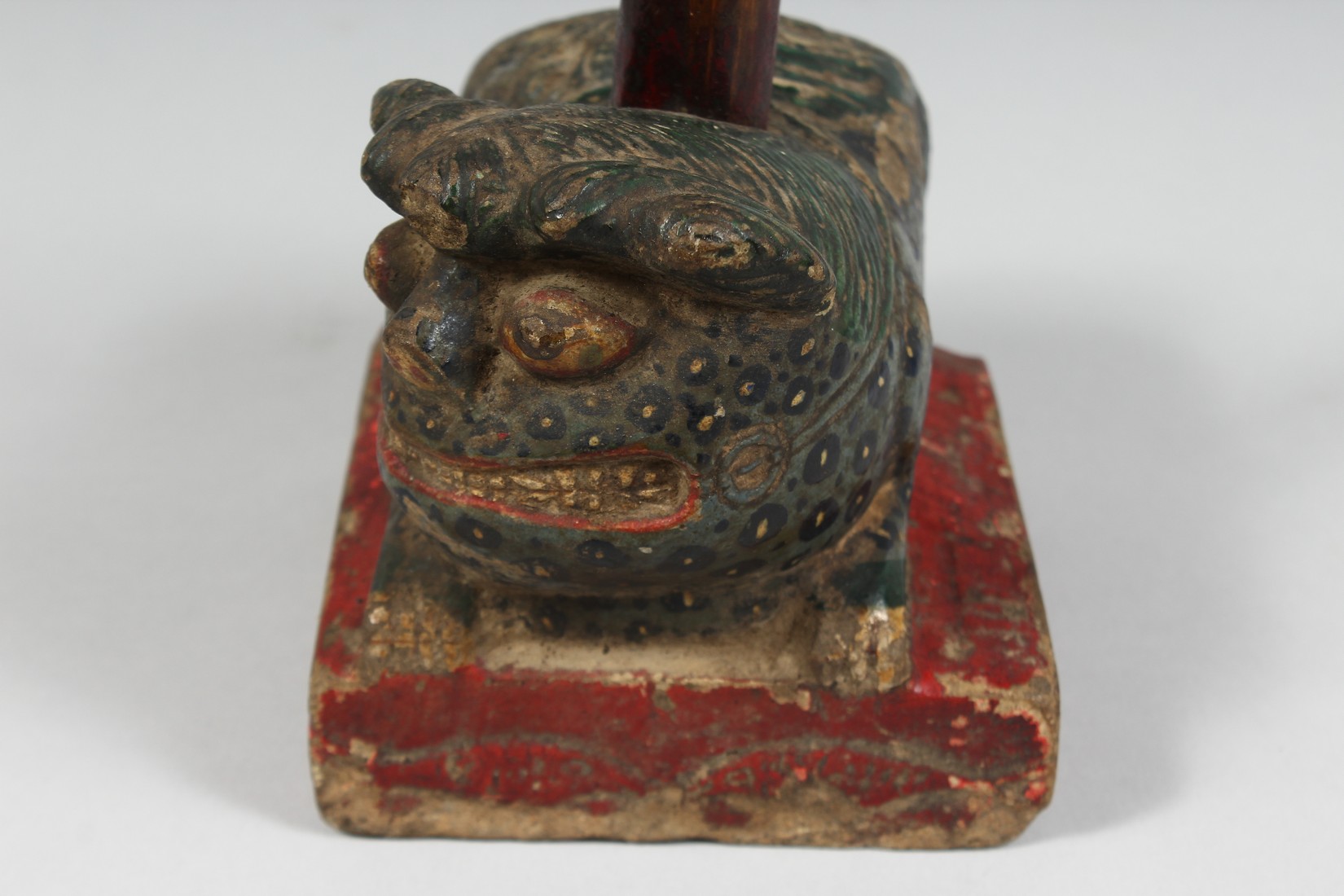 A CHINESE CARVED AND PAINTED STONE FIGURE OF A TEMPLE GUARDIAN, 15cm long. - Image 5 of 5