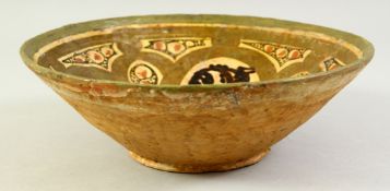 AN AFGHAN PART-GLAZED POTTERY BOWL, the interior painted with various motifs. 23.5cm diameter