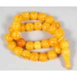 A STING OF AMBER STYLE BEADS AND TOGGLE.