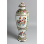 A TALL CHINESE CANTON PORCELAIN VASE AND COVER painted with panels of seated figures and further