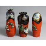 THREE JAPANESE SUMIDA POTTERY VASES, partly glazed with ribbed body and figures in relief, one