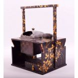 A SUPERB JAPANESE LACQUER SMOKERS CABINET / TABAKO BON, with gilt decoration, the top inset with a