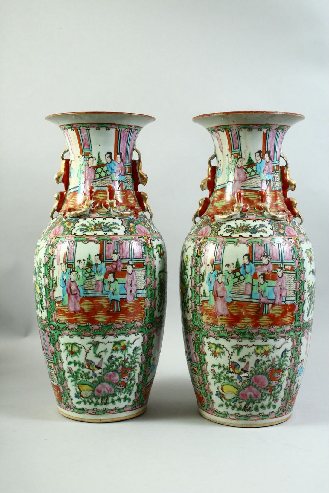 A PAIR OF CHINESE CANTON FAMILLE ROSE PORCELAIN VASES, the body of each painted with panels of - Image 3 of 7