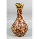 A GOOD LARGE CHINESE IRON-RED PORCELAIN GARLIC HEAD VASE, painted all over with flowerhead and