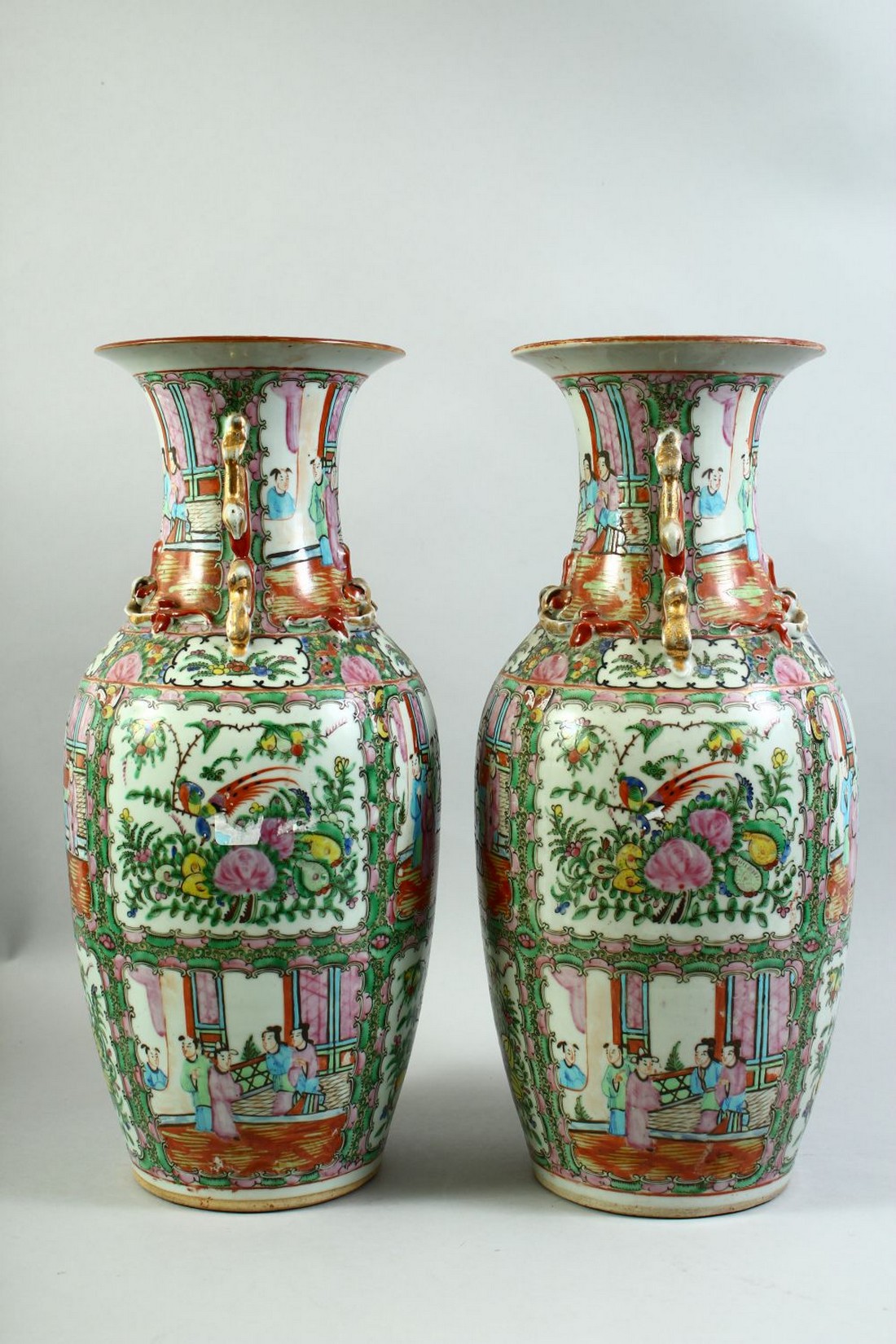 A PAIR OF CHINESE CANTON FAMILLE ROSE PORCELAIN VASES, the body of each painted with panels of - Image 2 of 7