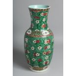 A CHINESE FAMILLE VERTE PORCELAIN VASE painted with numerous flower-heads upon a stylised pattern
