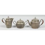 A FINE SIGNED PERSIAN THREE PIECE TEA SET, the teapot and jug with wooden handle, each piece with