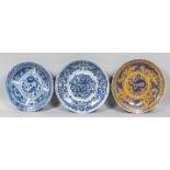 THREE LARGE CHINESE PORCELAIN DISHES, comprising two blue and white and one yellow ground dish; each