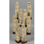 EIGHT CHINESE CARVED BONE FIGURES OF THE EIGHT IMMORTALS, each mounted to a hardwood base. Each