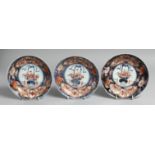 THREE JAPANESE IMARI PORCELAIN DISHES, each decorated with potted flowers and further decorated with