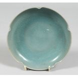 A CHINESE CELADON PETAL-FORMED PORCELAIN DISH. 15.cm diameter