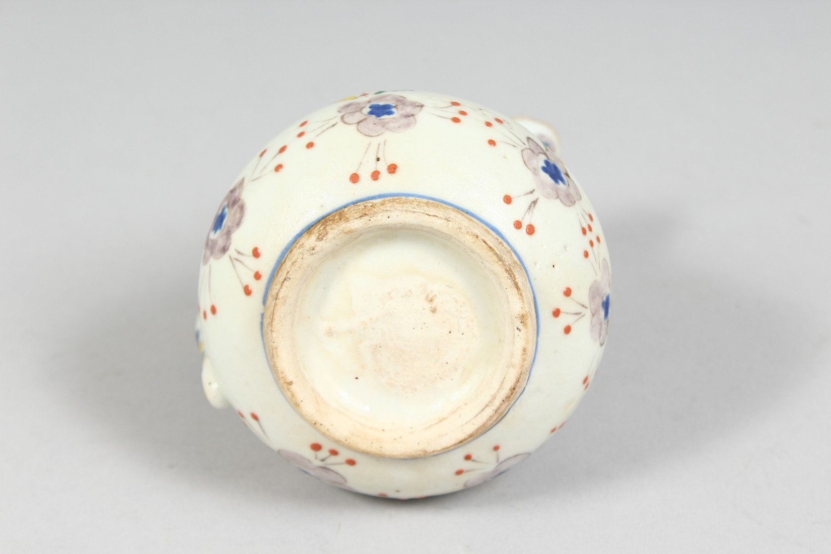 A SMALL TURKISH KUTAYHA POTTERY JUG, decorated with floral motifs, 12cm high. - Image 6 of 6