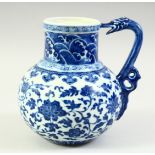 A CHINESE BLUE AND WHITE PORCELAIN JUG, the body painted with scrolling foliate decoration, the neck